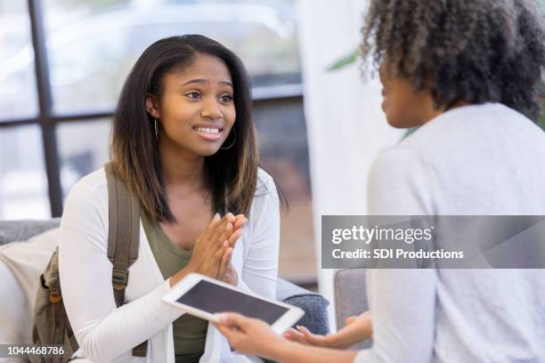 teenage girl begs her mom for permission - begging stock pictures, royalty-free photos & images