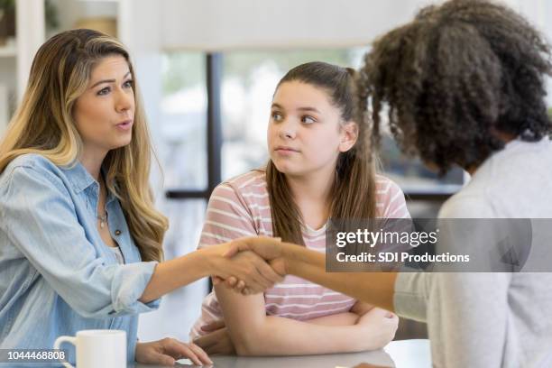 mom and daughter meet with counselor - family mediation stock pictures, royalty-free photos & images