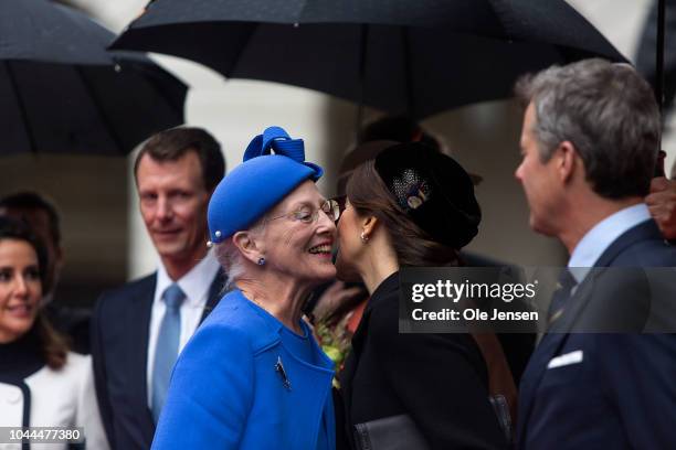 Queen Margrethe of Denmark greets Crown Princess Mary during the Royal family's arrival to Parliament where they attended the Prime Ministers opening...