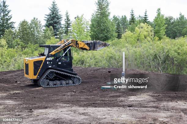mound septic system installation - septic tank stock pictures, royalty-free photos & images
