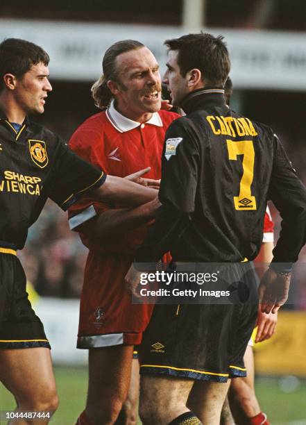 Swindon Town defender Brian 'Killer' Kilcline has words with United player Eric Cantona who is sent off for violent conduct as Roy Keane attempts to...