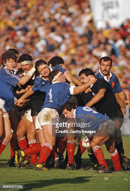France scrum half Pierre Berbizier prepares to pass the ball as prop Pascal Ondarts holds off All Black player Gary Whetton during the 1987 Rugby...