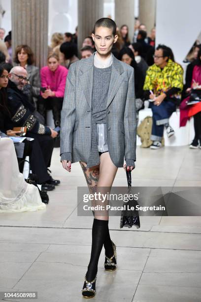 Model walks the runway during the Miu Miu show as part of the Paris Fashion Week Womenswear Spring/Summer 2019 on October 2, 2018 in Paris, France.