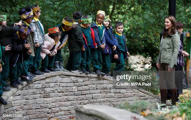 Catherine, Duchess of Cambridge says her goodbyes to children during a visit to Sayers Croft Forest School and Wildlife Garden on October 2, 2018 in...