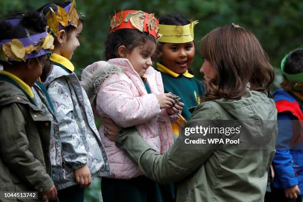 Catherine, Duchess of Cambridge hugs Amwaar, age 4, as she leaves Sayers Croft Forest School and Wildlife Garden on October 2, 2018 in London,...