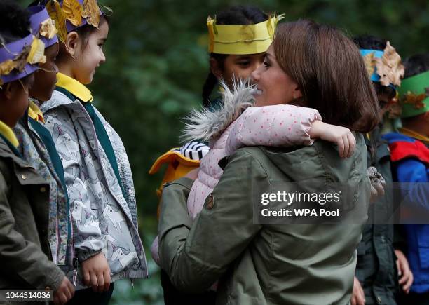 Catherine, Duchess of Cambridge hugs Amwaar, age 4, as she leaves Sayers Croft Forest School and Wildlife Garden on October 2, 2018 in London,...