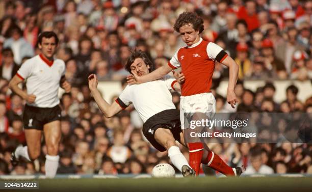 Arsenal player Peter Nicholas evades a challenge from Liverpool winger Steve Heighway as Ray Kennedy looks on during a First Division match at...