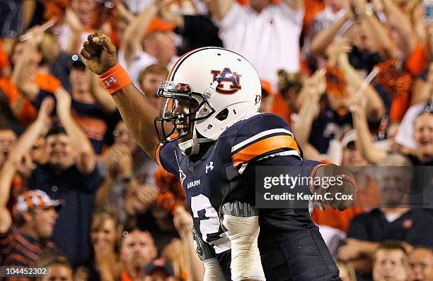 Quarterback Cameron Newton of the Auburn Tigers reacts after scoring a rushing touchdown against the South Carolina Gamecocks at Jordan-Hare Stadium...