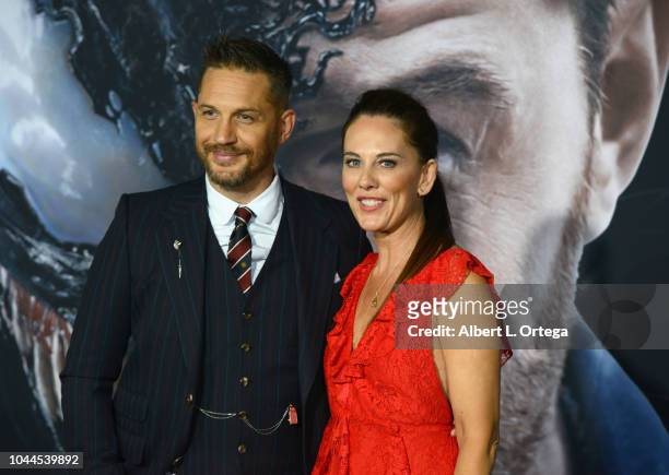 Actor Tom Hardy and writer Kelly Marcel arrive for Premiere Of Columbia Pictures' "Venom" held at Regency Village Theatre on October 1, 2018 in...
