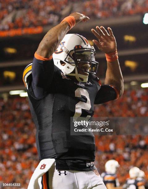 Quarterback Cameron Newton of the Auburn Tigers reacts after passing for a touchdown against the South Carolina Gamecocks at Jordan-Hare Stadium on...