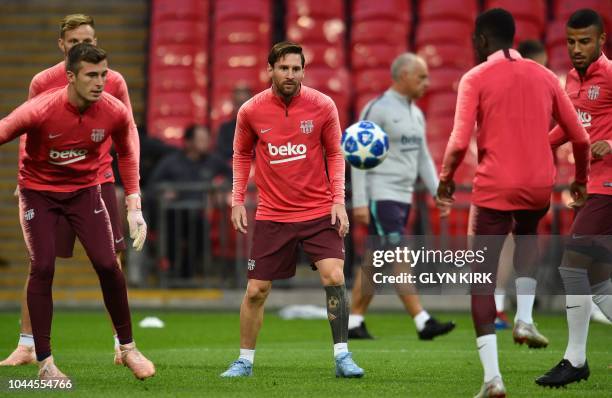 Barcelona's Argentine forward Lionel Messi attends a team training session at Wembley Stadium in north London on October 2 ahead of their Champions...