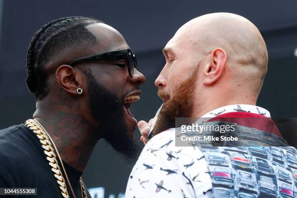 Heavyweight champion Deontay Wilder and Lineal Heavyweight champion Tyson Fury face-off during the New York Press Conference at Intrepid...