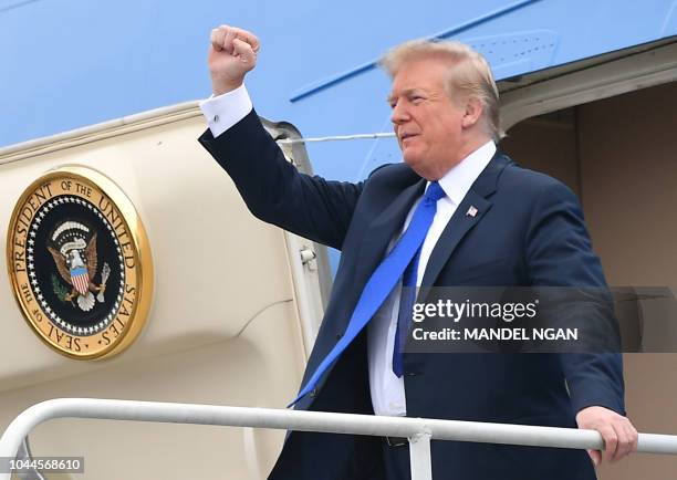 President Donald Trump steps off Air Force One upon arrival at Philadelphia International Airport in Philadelphia, Pennsylvania on October 2, 2018. -...