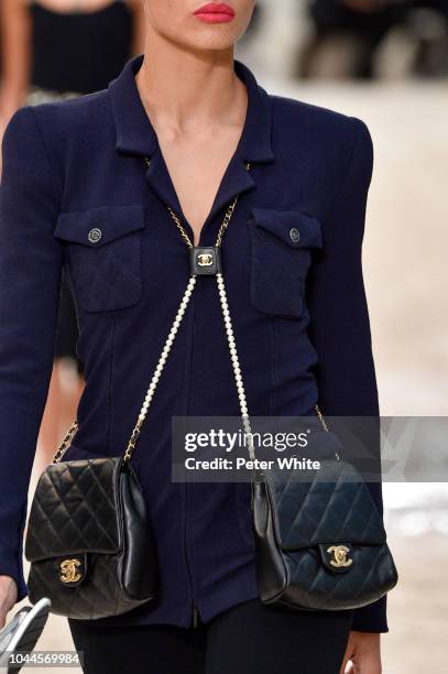 Model, bag detail, walks the runway during the Chanel show as part of the Paris Fashion Week Womenswear Spring/Summer 2019 on October 2, 2018 in...