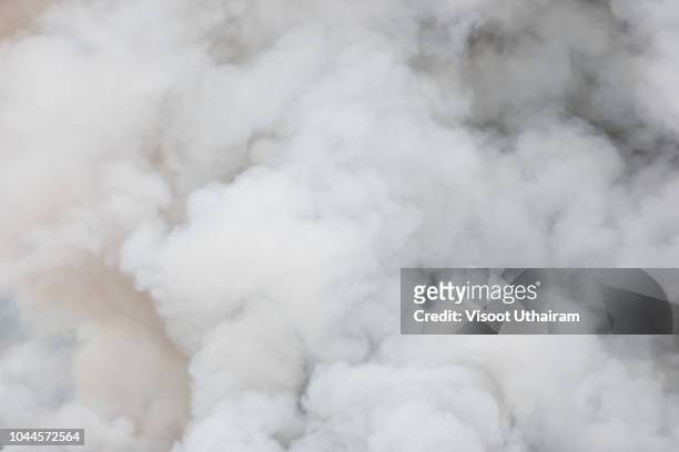 smoke caused by explosions,white smoke like clouds background. - destruction background stock pictures, royalty-free photos & images