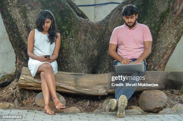 couple working in a park - bangalore tourist stock pictures, royalty-free photos & images