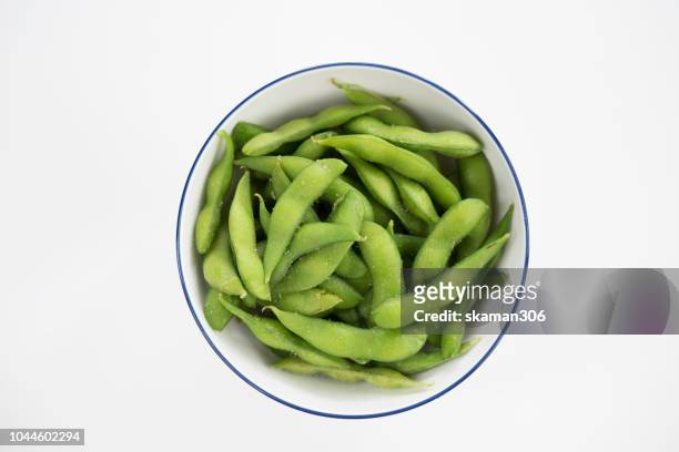 japanese green pea (edamame)on plate with white background - edamame stock pictures, royalty-free photos & images
