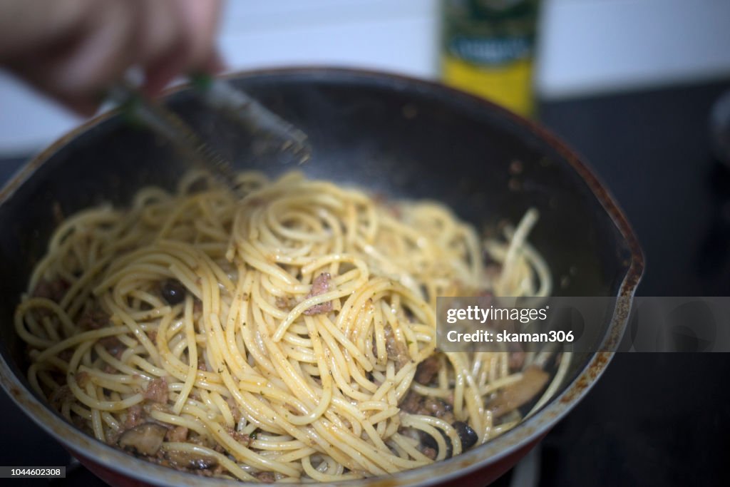 Boiled water and spaghetti noodle for cooking italian pasta