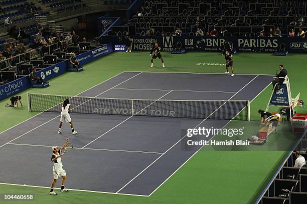 Rogier Wassen of Netherlands serves with team mate Dustin Brown of Jamaica looking on during the doubles final against Marcelo Melo and Bruno Soares...