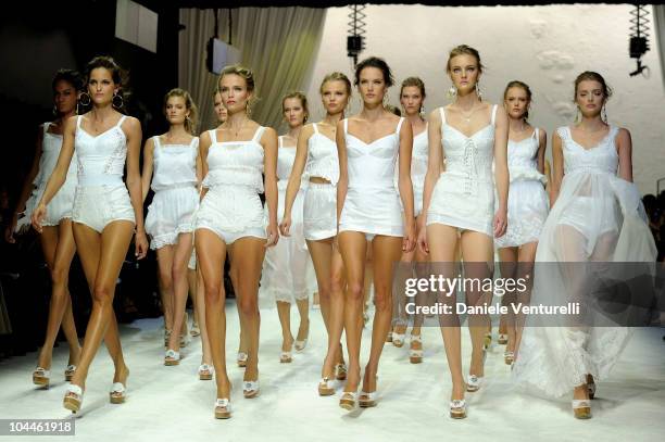 Models walk down the runway during the Dolce & Gabbana Womenswear S/S 2011 show during Milan Fashion Week on September 26, 2010 in Milan, Italy.