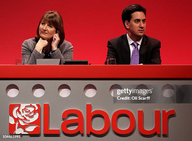 The new leader of the Labour Party Ed Miliband and deputy leader Harriet Harman listen to a tribute to Michael Foot, a former Labour leader who...