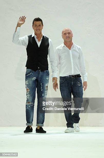 Italian Designers Stefano Gabbana and Domenico Dolce acknowledge the applauses at the end of the Dolce & Gabbana Womenswear S/S 2011 show during...