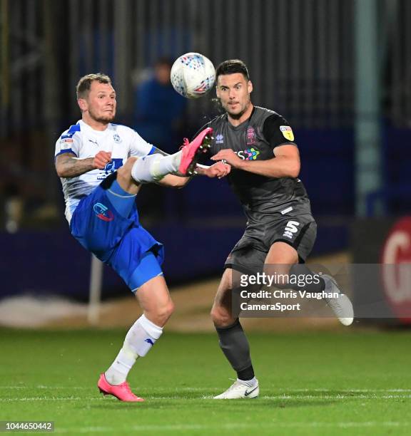 Lincoln City's Jason Shackell vies for possession with Tranmere Rovers' James Norwood during the Sky Bet League Two match between Tranmere Rovers and...