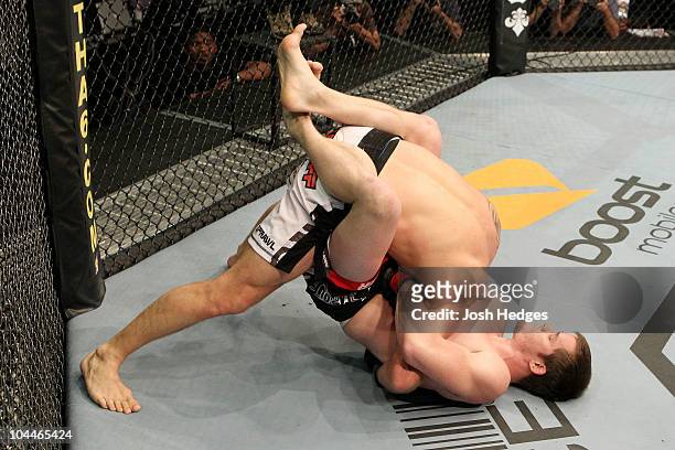 Dollaway chokes Joe Doerksen during their UFC middleweight bout at Conseco Fieldhouse on September 25, 2010 in Indianapolis, Indiana.