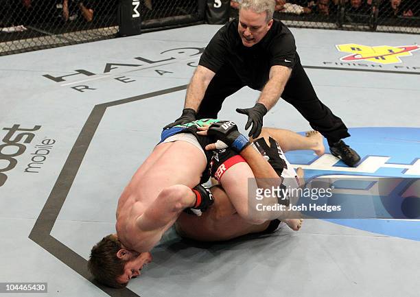 Referee Jeff Malott stops the fight as CB Dollaway chokes Joe Doerksen during their UFC middleweight bout at Conseco Fieldhouse on September 25, 2010...