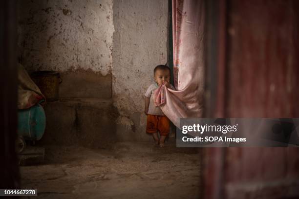 Uyghur boy is pictured on the street of the Kashgar old town, northwestern Xinjiang Uyghur Autonomous Region in China. Kashgar is located in the...