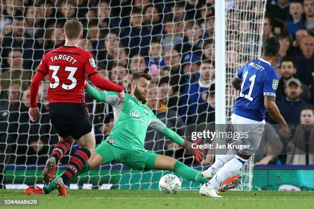 Theo Walcott of Everton scores his team's first goal during the Carabao Cup Third Round match between Everton and Southampton at Goodison Park on...