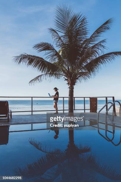 swimming pool at seaside in vietnam - hot vietnamese women stock pictures, royalty-free photos & images