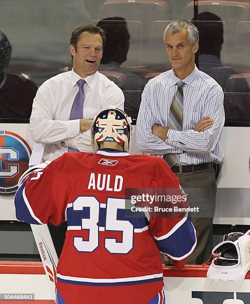 Assistant Coach Kirk Muller speaks with Alex Auld of the Montreal Canadiens prior to the game against the Ottawa Senators at the Bell Centre on...