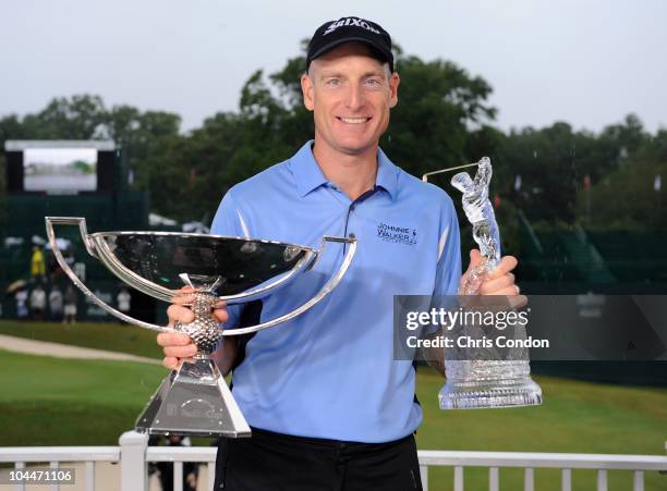 Jim Furyk poses with the tournament trophy and the FedEx Cup after winning THE TOUR Championship presented by Coca-Cola, the final event of the PGA...