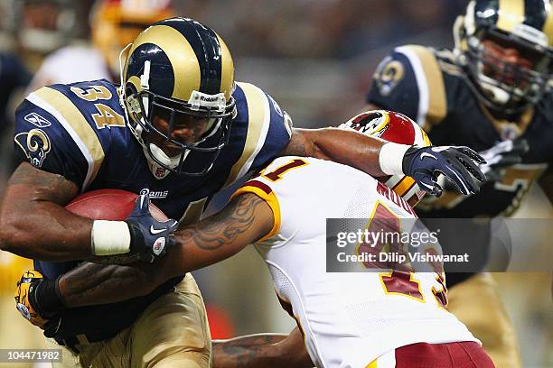 Kenneth Darby of the St. Louis Rams rushes against the Washington Redskins at the Edward Jones Dome on September 26, 2010 in St. Louis, Missouri. The...