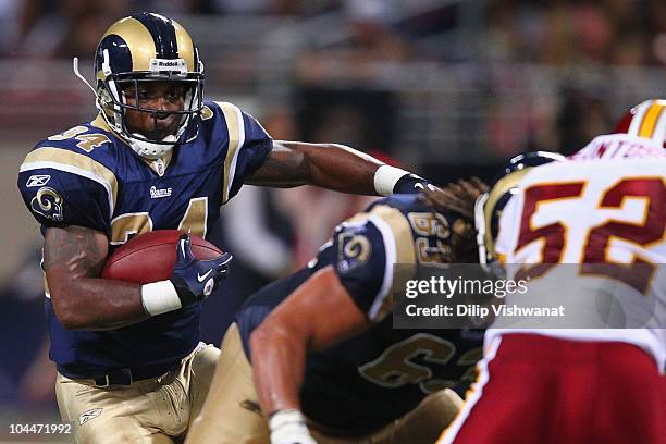 Kenneth Darby of the St. Louis Rams rushes against the Washington Redskins at the Edward Jones Dome on September 26, 2010 in St. Louis, Missouri. The...