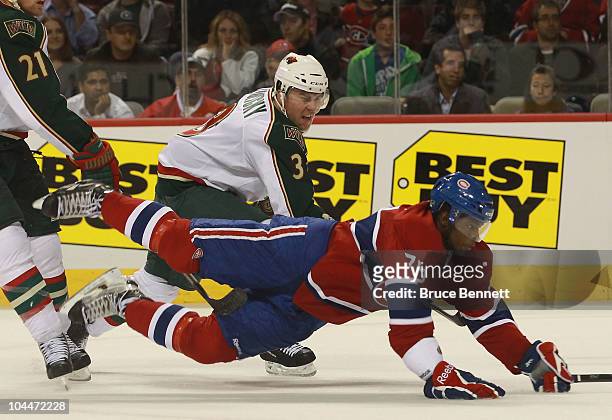 Marek Zidlicky of the Minnesota Wild takes a two minute penalty for tripping P.K. Subban of the Montreal Canadiens at the Bell Centre on September...