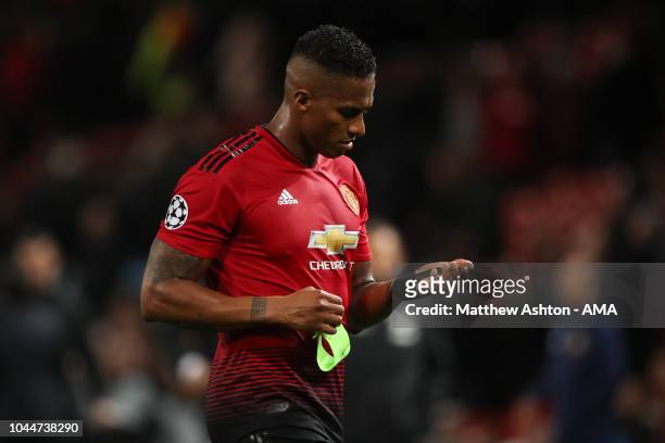 Dejected Antonio Valencia of Manchester United walks off the pitch at full time during the Group H match of the UEFA Champions League between...