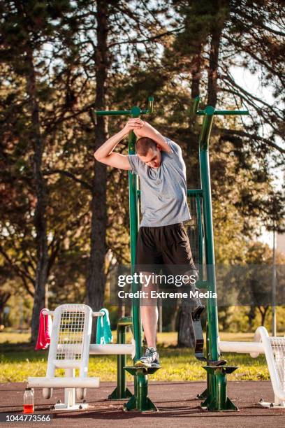 disabled man exercising in outdoor gym - counting stock pictures, royalty-free photos & images