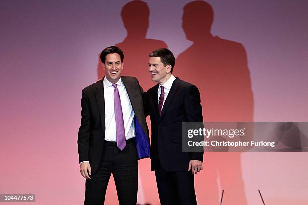 Former foreign secretary David Miliband is embraced by his brother Labour party leader Ed Miliband after giving a keynote speech to delegates during...