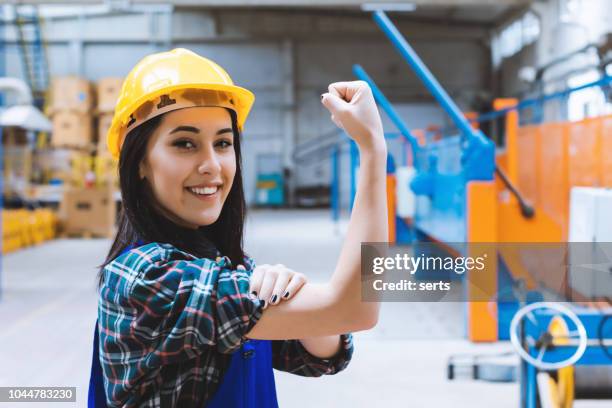 we can do it - powerful young worker woman in a success pose - rosie the riveter stock pictures, royalty-free photos & images