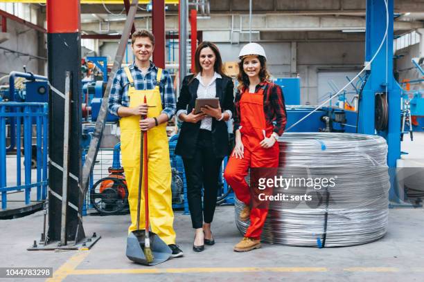 group portrait of industry workers in distribution warehouse - garbage man stock pictures, royalty-free photos & images