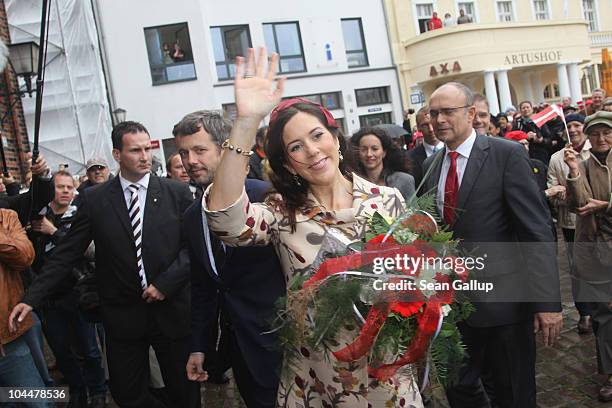 Danish Crown Prince Frederik and Crown Princess Mary, who is pregnant with twins, arrive at the main square on September 27, 2010 in Stralsund,...