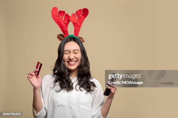 asian girl wearing a christmas hat - santa portrait stock pictures, royalty-free photos & images