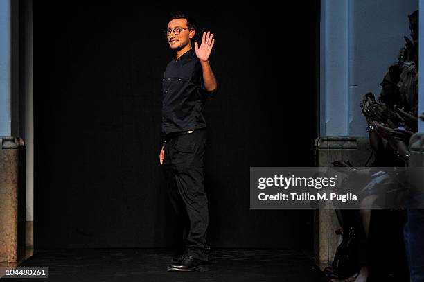 Italian Designer Marco de Vincenzo acknowledges the applause of the public after the Marco de Vincenzo Womenswear S/S 2011 show during Milan Fashion...