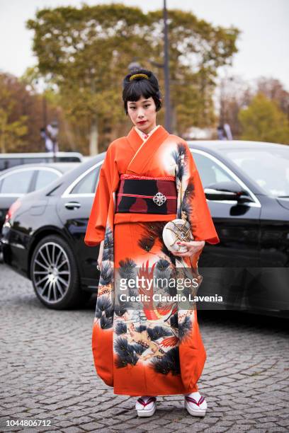 Mademoiselle Yulia, wearing a traditional Japan dress, is seen before the Chanel show on October 2, 2018 in Paris, France.