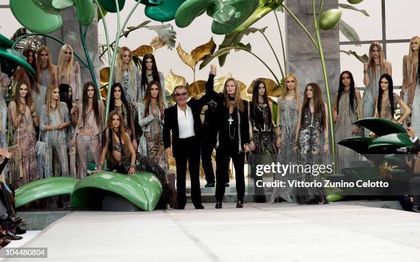 Roberto and Eva Cavalli acknowledge the applause of the public after the Roberto Cavalli Milan Fashion Week Womenswear S/S 2011 show on September 27,...