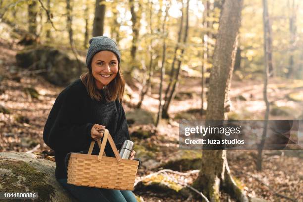 woman picking mushrooms and drinking coffee in the forest - scandinavia picnic stock pictures, royalty-free photos & images