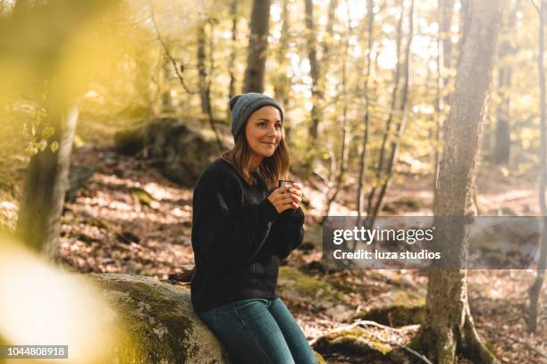 woman picking mushrooms and drinking coffee in the forest - scandinavian descent stock pictures, royalty-free photos & images