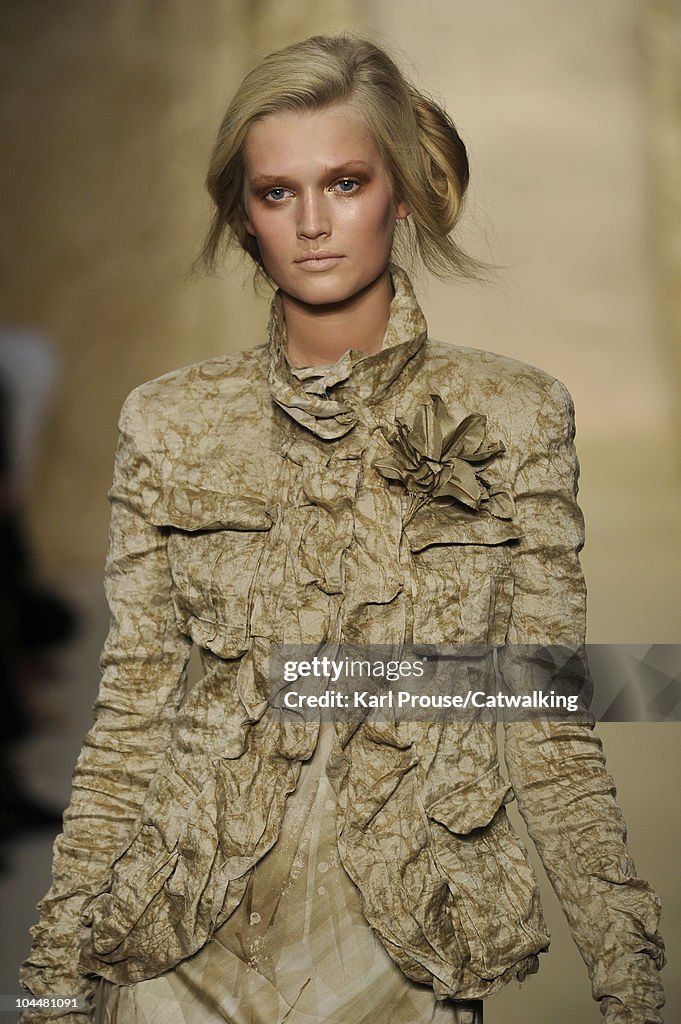 A model walks the runway at the Donna Karan Spring Summer 2011... News ...